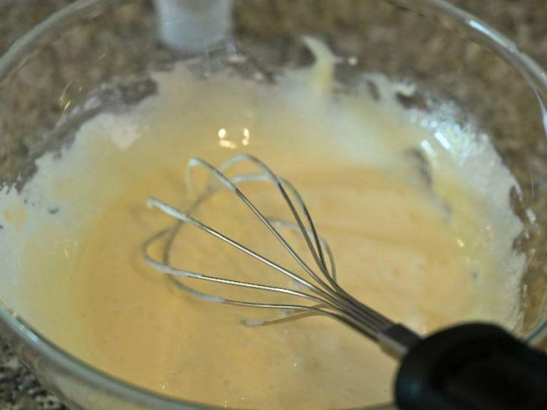 In a large whisk together the egg yolks and sugar, until thick and creamy.