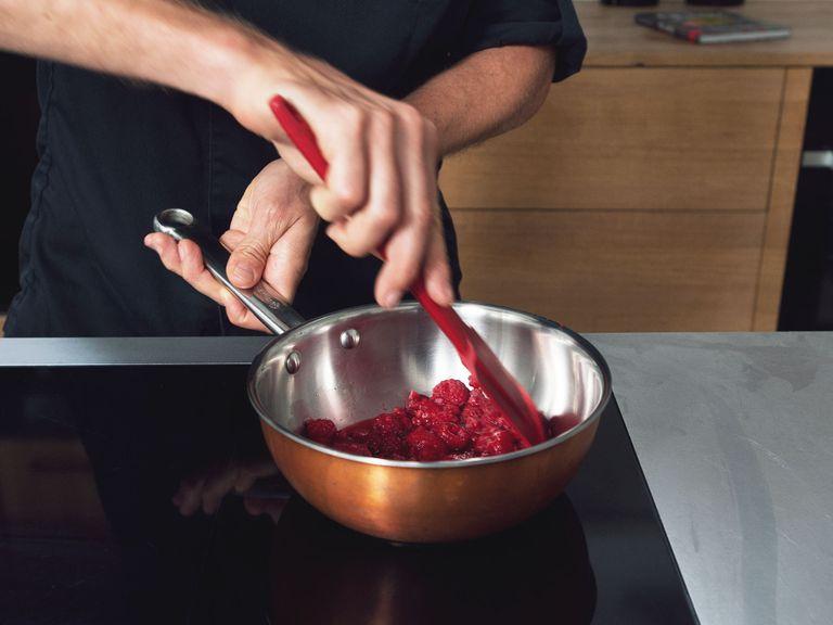 Add two-thirds of the raspberries to a small saucepan and bring to a boil over medium-high heat to defrost.