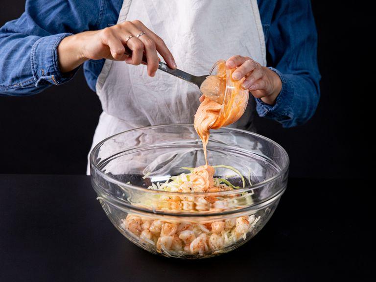 Add shrimp and dressing to a bowl with cabbage. Mix everything together and season to taste. Add some butter to the same frying pan and toast the bread on one side. Scoop some of the shrimp and cabbage mixture onto the bread and top with another slice. Enjoy!