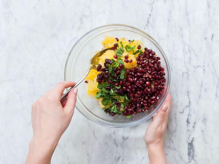 Remove squash from oven, fray out the pulp with a fork, add to a large bowl and let cool down. Once cool, add mint, walnuts, dried cranberries, and pomegranate seeds and mix well.