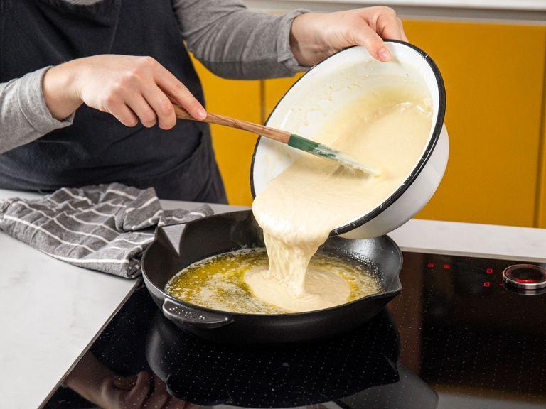 Add butter to a cast-iron pan and let melt. When it begins to sizzle, pour the batter carefully into the pan. Transfer pan in the oven and bake at 220°C/430°F for approx. 20 min. or until the Dutch baby has turned golden-brown and fluffy. Make sure all edges have risen evenly.