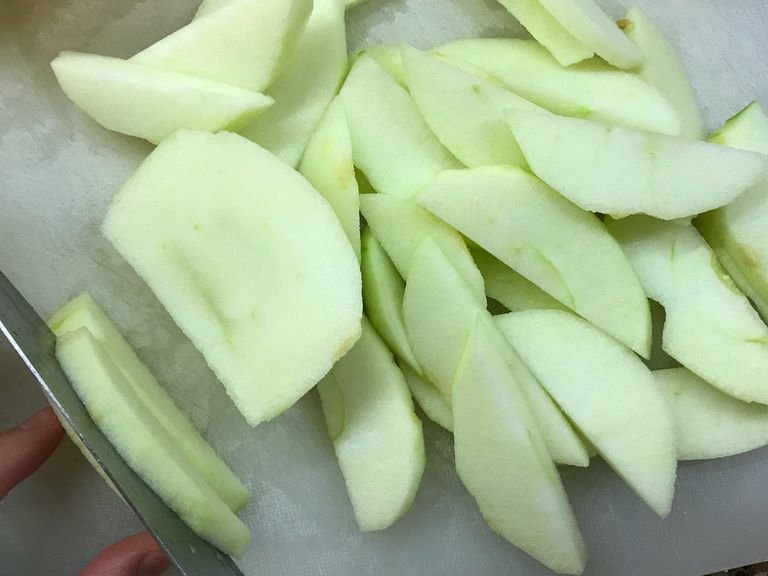 First, peel and chop apples