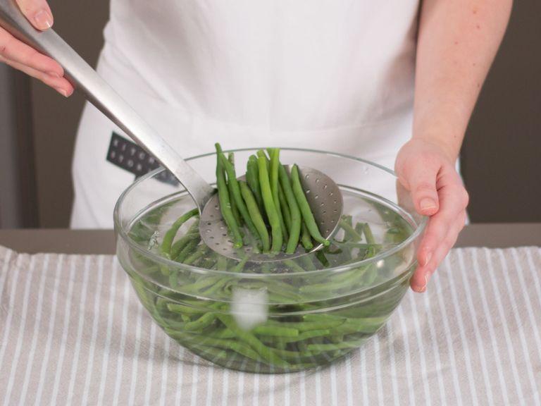 Trim green beans. Add half of the summer savory to a large saucepan of boiling, salted water. Blanch green beans for approx. 2 min. and transfer to a large bowl of water mixed with ice cubes. Take beans out of cold water after approx. 1 min. and set aside.