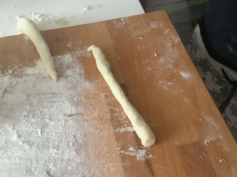 Create worm like dough strips 