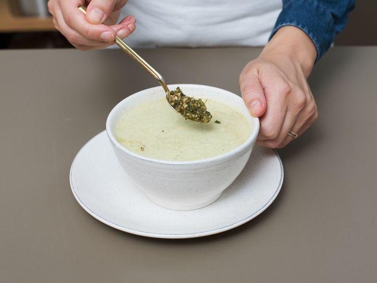 Remove the soup from the stove and purée with a hand blender until smooth. Season with salt, pepper, and more lemon juice to taste and serve with walnut-mint pesto. Enjoy!
