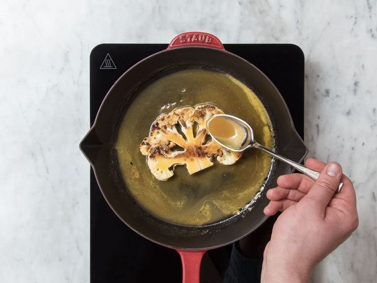 Remove cauliflower steak from the pan. Add mirin and orange miso mixture to the pan and let reduce. Transfer cauliflower steak back to the pan, transfer to the oven, and bake at 220°C/430°F for approx. 10 min.