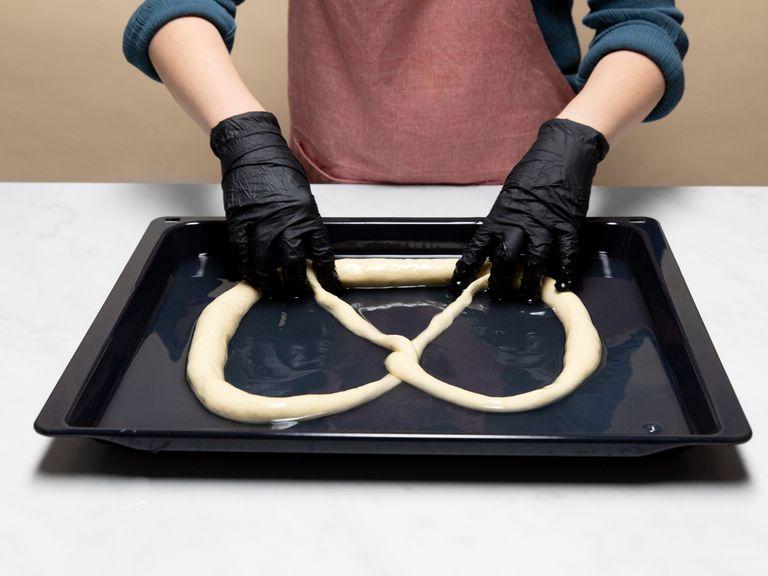 Let the pretzels rise for approx. 1 hr., then transfer them to the freezer and let chill for approx. 10 min. Then add lye to a baking sheet and gently dip the pretzel to coat. Score the thick middle section of the pretzels with a sharp knife and sprinkle with coarse sea salt. Bake in a preheated oven at 220°C/430°F for approx. 15 – 20 min., or until they are deep brown. Enjoy!