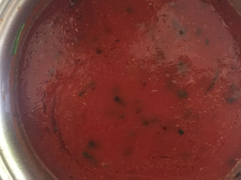 pour in a can of tomato purée, and season to taste. I recommend using oregano, chili flakes, paprika, salt, pepper and sugar. Let boil for a few minutes, then set aside