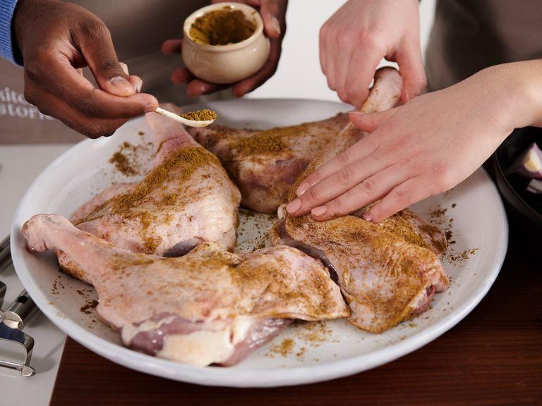 Preheat oven to 160°C/320°F. Wash and pat dry goose legs. Rub with salt and half of garam masala. Peel and quarter the onions and transfer to a roasting pan. Place goose legs on top and add the goose stock. Bake for approx. 90 min. in a preheated oven.
