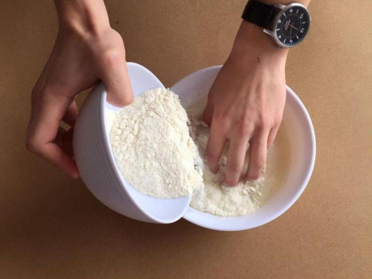 stir water and a pinch salt together in a large bowl to dissolve the salt. Gradually add the cornmeal, mixing with your fingers to dissolve any lumps, adding enough to make a soft dough that holds its shape without cracking when molded.