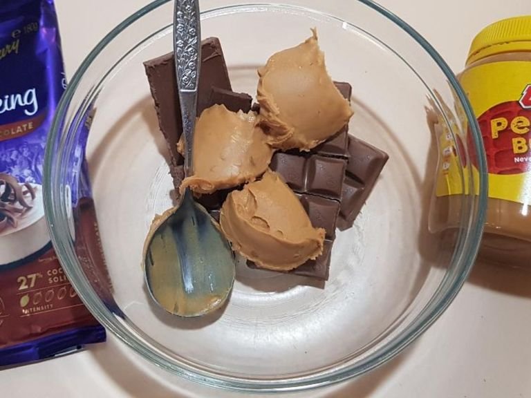 Melt chocolate & peanut butter together in the microwave in a microwave proof bowl. Do it slowly so you don't burn the chocolate. Check approximately every 20 seconds. See if your microwave has a "melt" setting.