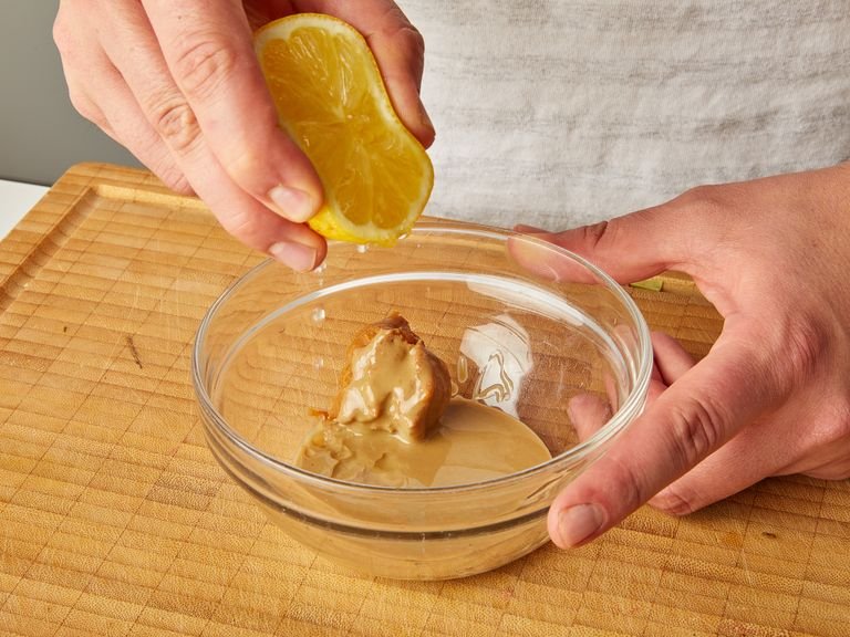 In a small bowl mix the tahini, lemon juice, miso paste, and yogurt and whisk with a fork until smooth. Then season with pepper and add more lemon juice to taste.