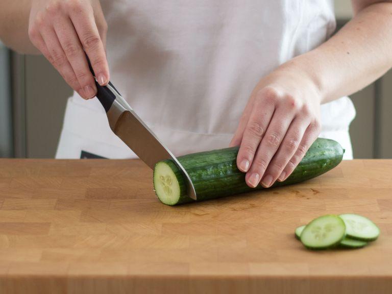 Cut cucumber into slices.