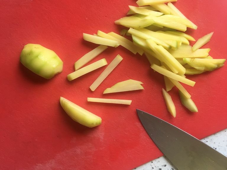 Meanwhile, cut the potatoes, skinned or not, into match sticks and add them into a bowl of salted water until ready for frying. Wash the dried lemon, put some score over them and soak them in hot water, washing out their probable bitterness.