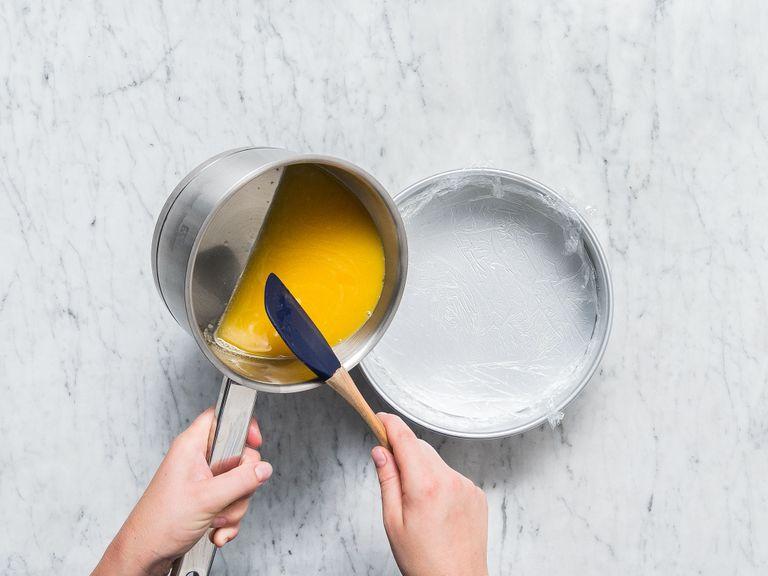Line a springform pan with plastic wrap and transfer the orange-gelatin liquid to the tin. Let chill in the fridge for approx. 2 hrs., or until the liquid has set and is firm.