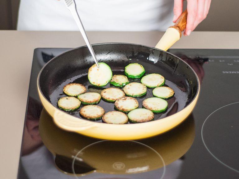 In the same pan, fry zucchini slices for approx. 2 – 3 min. on each side until golden brown and soft. Add more oil if needed. Set aside.