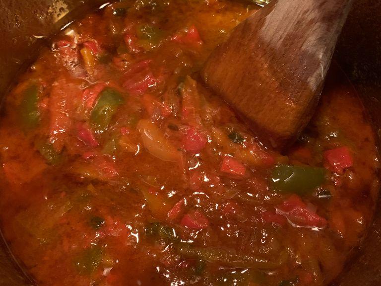 Add in peppers!! Keep heat on medium low and cover pot. Watch the juice from the peppers flow out and concentrate the flavors into the oil by reducing on low heat for the next 5 hours. Once the consistency is thickened a bit, your peperonata is ready!