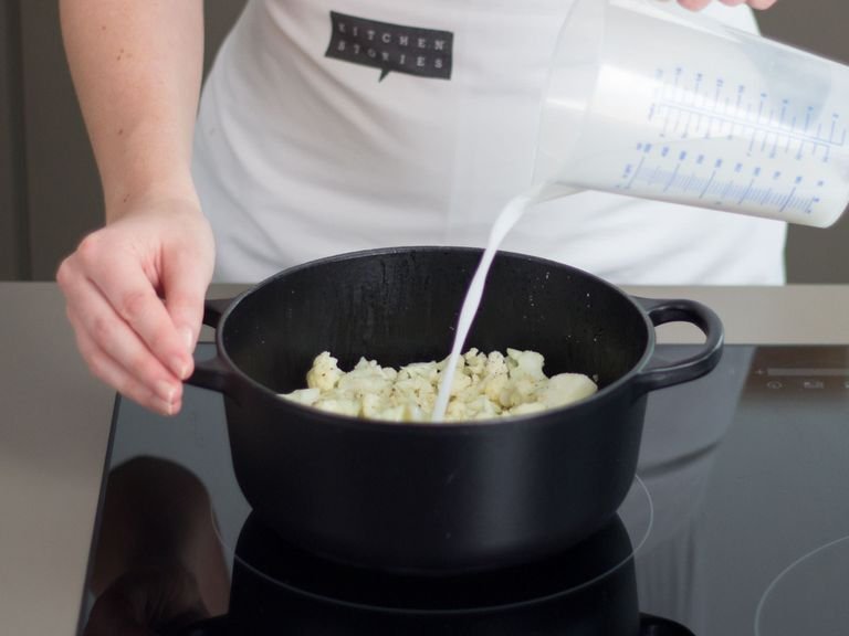 Add chopped cauliflower, rice milk, and cloves to a small saucepan. Salt to taste. Cook for approx. 15 min. until cauliflower is soft. Remove cloves and puree until smooth with a hand blender. Stir in olive oil and keep warm.