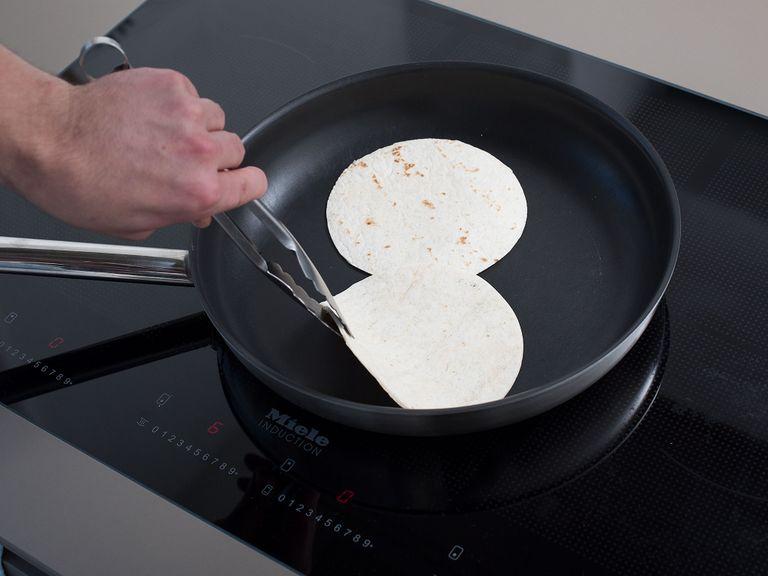 Heat a dry frying pan over medium heat and toast each tortilla on both sides for approx. 20 – 30 sec.