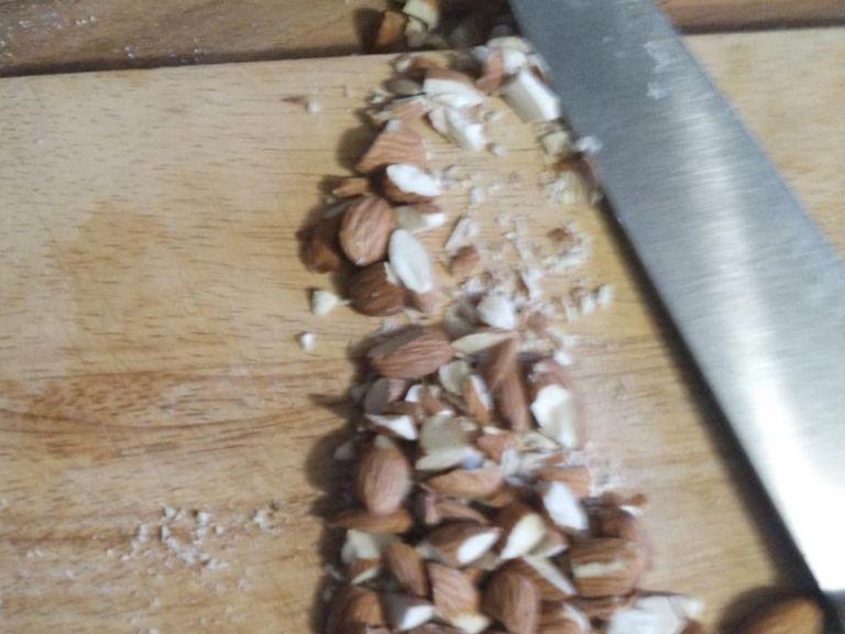 Finely chop the almonds, and toast with the flour over a medium heat. Be careful, as flour can burn without you knowing - it is ready when it's a very light grey-brown colour.