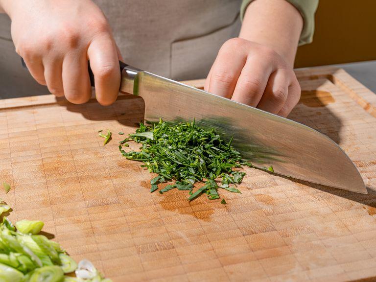 Clean scallion, finely slice the white part into rings and julienne the green lengthwise. Peel and thinly slice ginger. Pluck tarragon leaves from the stems and reserve the stems for later. Finely chop tarragon leaves.