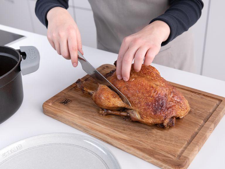 To carve a roast chicken, duck, or turkey, transfer it to a cutting board with a carving fork. Remove any toothpicks or twine, if necessary. Then remove the drumsticks by slicing between the drumstick and the breast. Repeat on the other side.