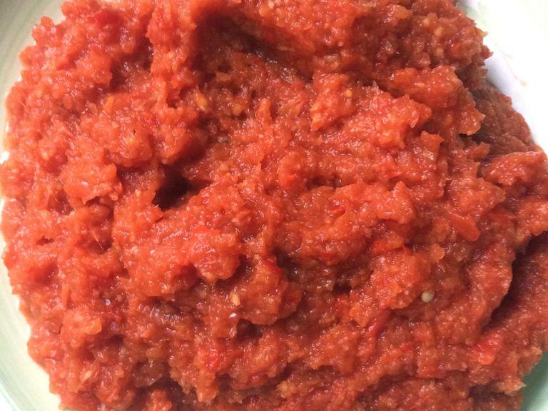 Pour the mixture in a heated pan and allow to cook for about 15 minutes on low heat, stirring frequently when it’s almost dried out and to avoid burning. Add the tomato paste, stir for about 5 minutes.