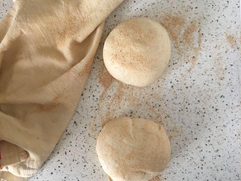 Carefully transfer the risen dough onto a floured work surface and fold for 2-4 times. Divide in two and cover again with the damp towel for second rise, about 30-45 min. Meanwhile, prepare the filling, preheat the oven to 240 C and lightly grease a large baking sheet.
