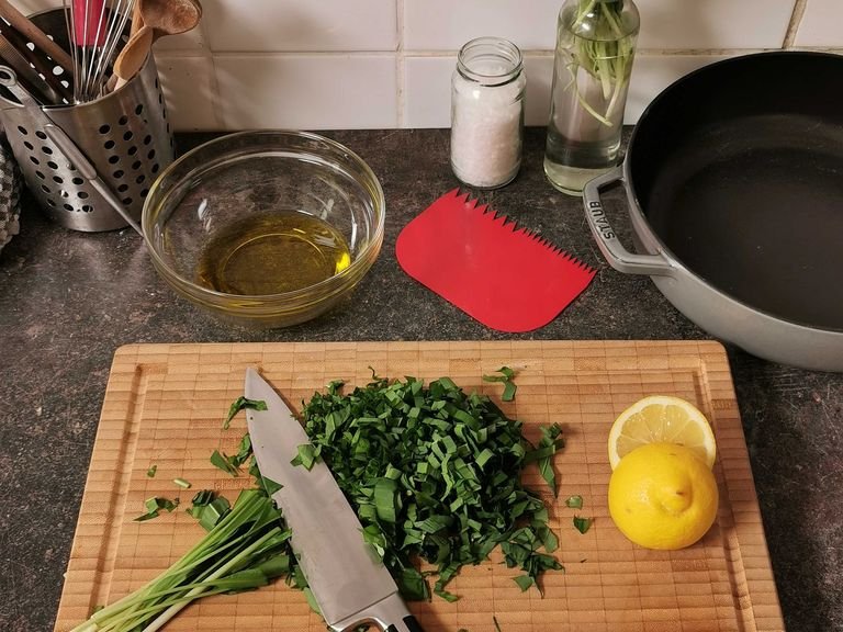 In the meantime, prepare the wild garlic oil. Finely chop the wild garlic and add to a bowl with the remaining olive oil, lemon juice, and salt, and mix well.