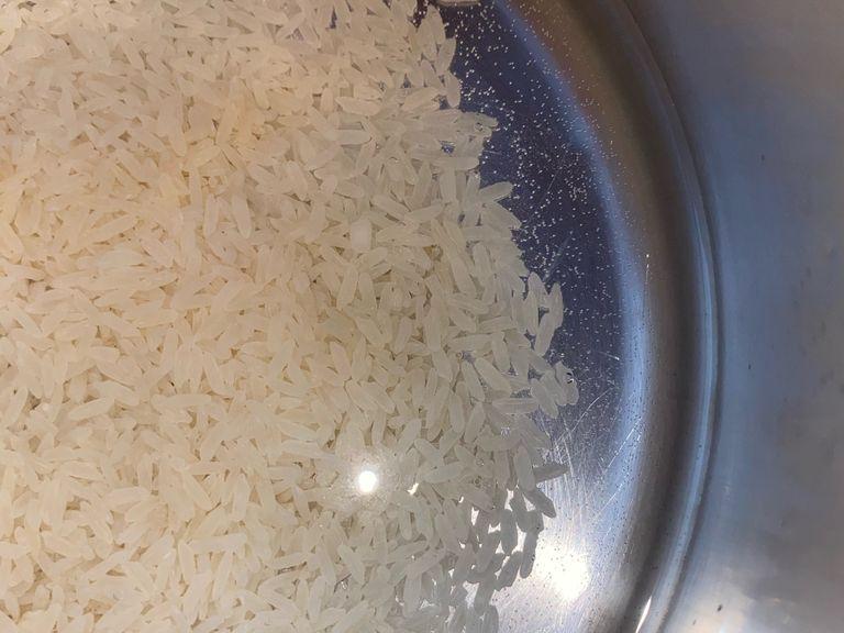Turn on stove on the highest setting add water, rice and add as much salt as you want for flavor