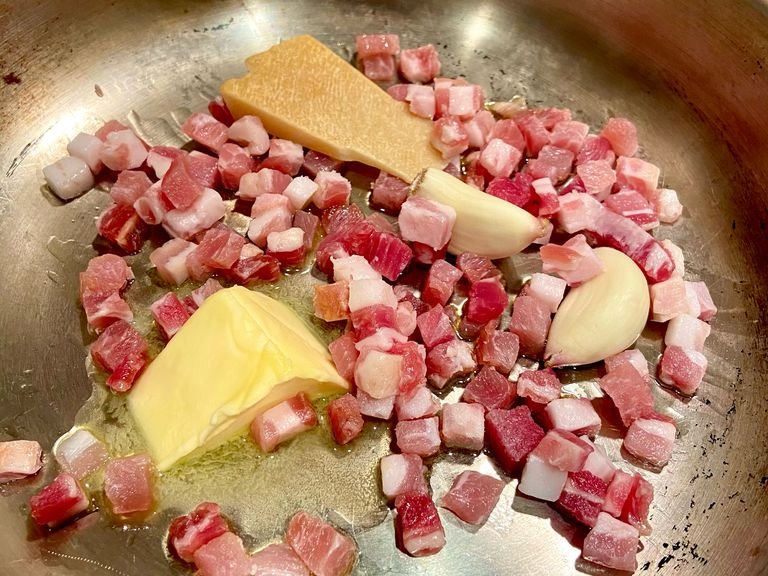 Add Pancetta to the pan - keep on a low heat so that the fat melts into the pan. Important for the sauce. Place the pasta into the water once boiling. Remember to cook for 1 minute less than the package says. It’ll keep cooking once off the heat.
