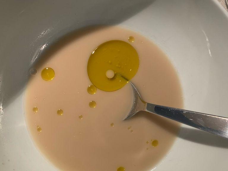 Add warm water to a bowl, then add the yeast, sugar and olive oil. Mix until all ingredients are melted.
