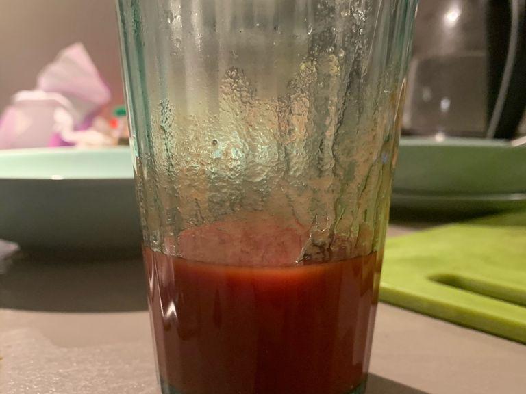 Meanwhile, add white vinegar, tomato paste and sugar in a glass. Mix well with a spoon.