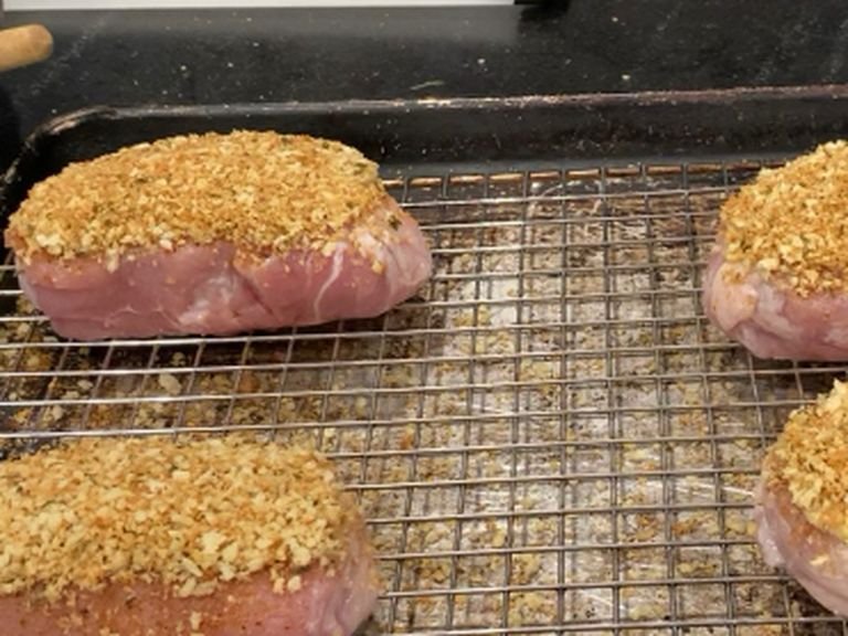Next put the bread crumbs on each pork chop, again patting it gently to somewhat pack the bread crumbs. Then bake at 250 Degrees ￼Fahrenheit￼ for an hour or until the internal temperature is 150 Degrees￼Fahrenheit