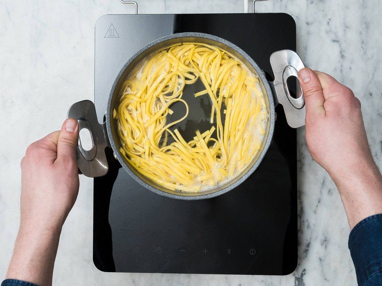Bring a pot of water to a boil over medium-high heat. Salt generously and cook tagliatelle until al dente. Drain, reserving some pasta water.