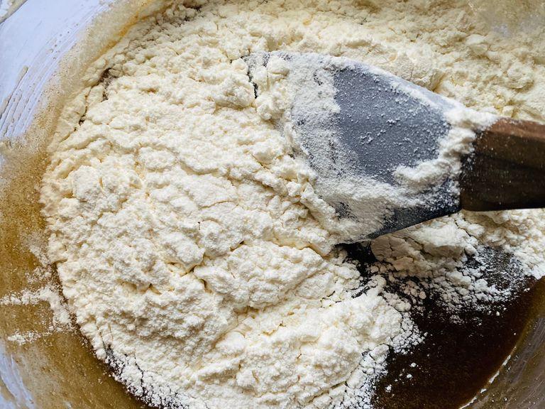 Add the flour mixture to the sugar egg mix and combine until a soft dough forms