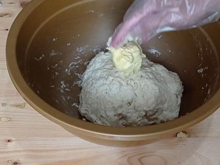 Knead the dough : Add the butter and mix well with your hand. Then transfer the dough on the silicone mat. Knead the dough until smooth and elastic.
