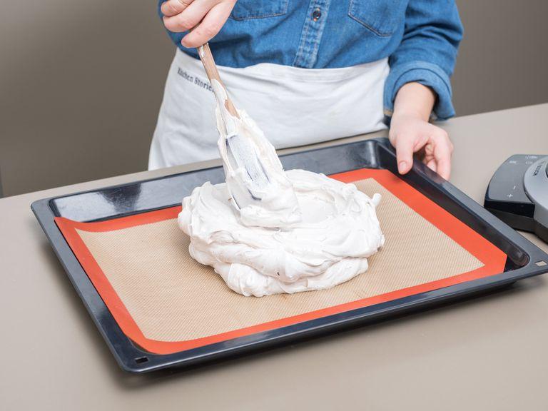 Transfer to a baking sheet lined with a silicone baking mat and gently flatten the meringue into shape. Reduce oven heat to 130°C/260°F and bake at for approx. 1.5 hrs. Remove and let cool.