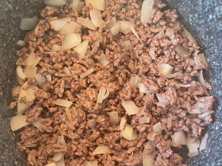 Once you have your onions fried add your onions and mince into a big pot and mix together with out heat.