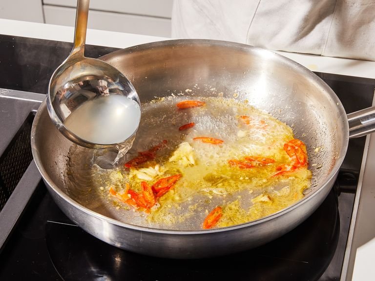 Just before the pasta is ready, add lemon zest and juice to the frying pan and season the mixture with salt and pepper. Scoop out the recommended amount of pasta water, add to the pan, and turn the heat up to medium-high so it bubbles and reduces.