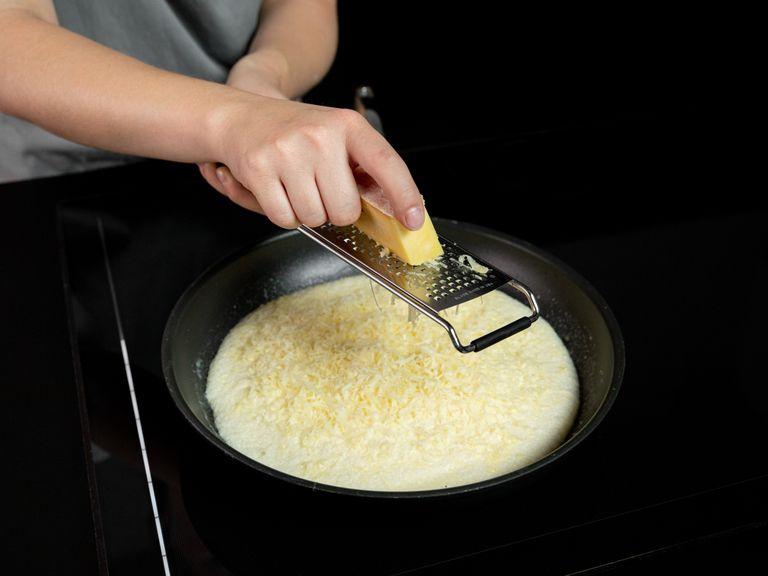 Add butter to a small nonstick frying pan over medium heat. Once melted, swirl to coat the pan, then add the egg mixture and gently smooth the top. Add half the cheese, cover the frying pan, and let cook for approx. 3 min.