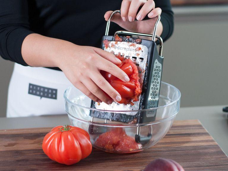 Meanwhile, grate tomatoes on box grater, using the side with the large holes. Discard skins and stems.
