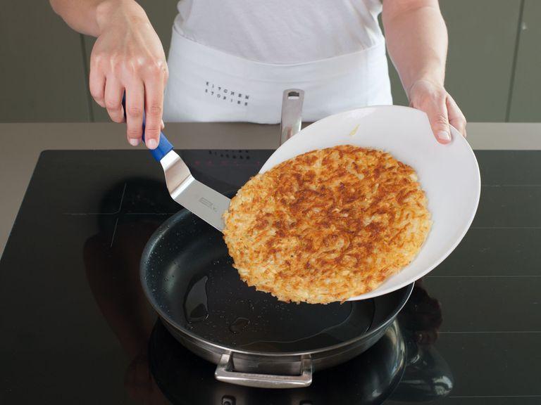 Heat vegetable oil in skillet over medium-high heat. Add potatoes in an even layer and cook, undisturbed, until bottom forms a deep golden-brown crust, approx. 5 min. Use a large plate to flip hash browns in one piece and cook the other side, approx. 5 min. more, adding more vegetable oil if needed. Transfer to a paper towel-lined plate to drain.