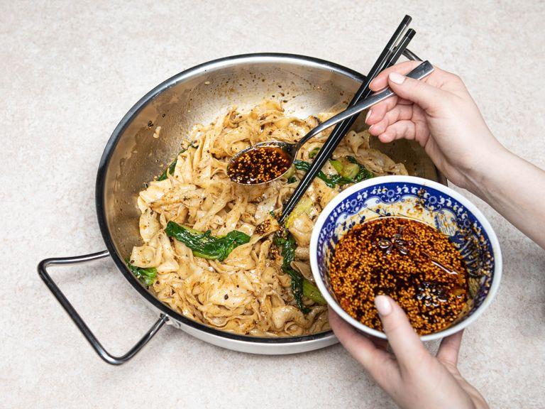 Cook noodles in salted boiling water for 2 - 3 min., then add bok choy and let blanch. Divide noodles among serving bowls and top with seasoned soy sauce and lots of chili oil and enjoy!
