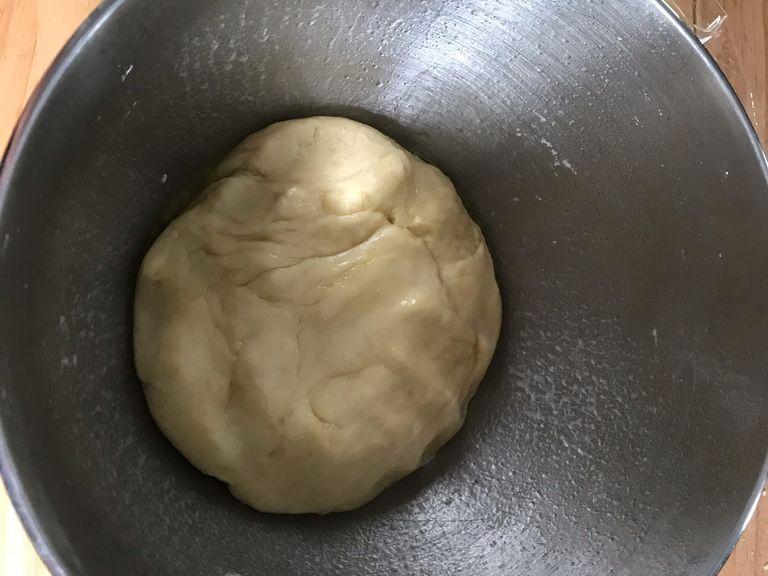 Take your dough out of the bowl it should be much bigger and thicker oil a sheet pan and place your dough down and roll it out. place whatever toppings you desire in top.
