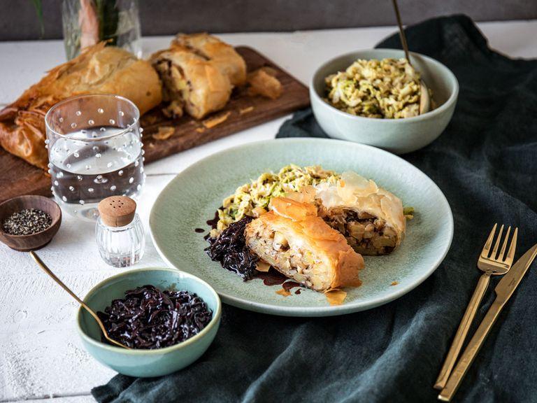 Savory potato and hazelnut strudel with braised cabbage and red wine sauce
