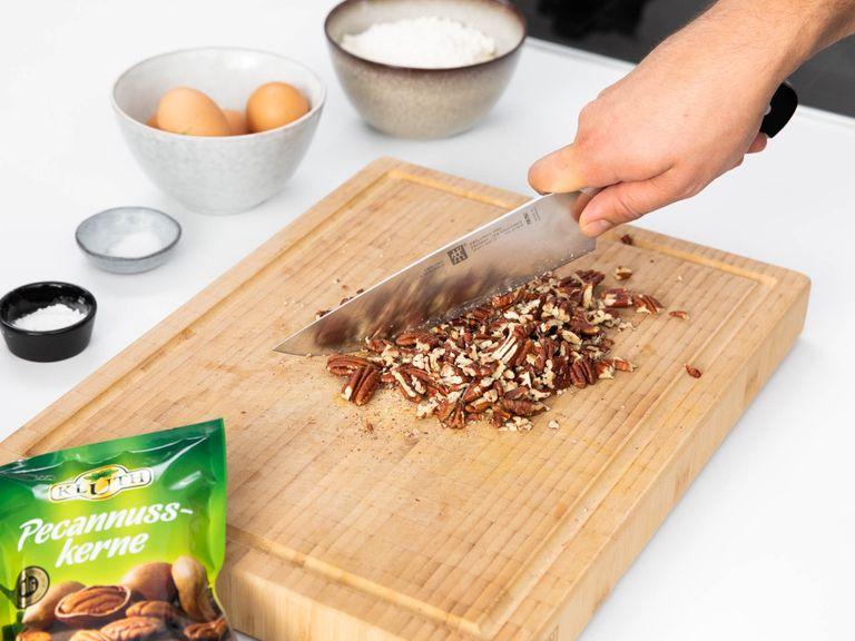Preheat oven to 180°C/360°F. Roughly chop pecans. Combine flour, baking powder, and salt in a bowl.