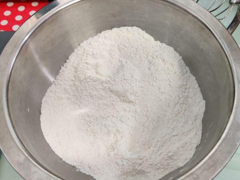 in a medium size mixing bowl, combine the cake flour, all purpose flour, corn starch, salt, and baking soda.