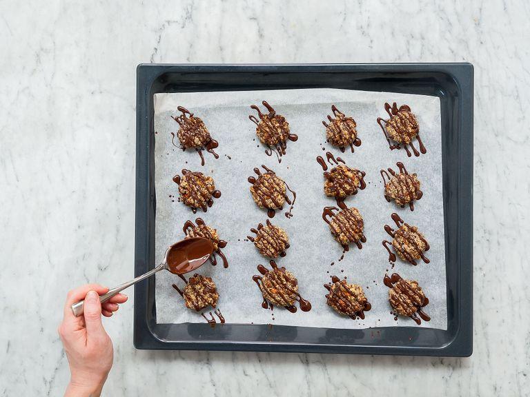In the meantime, melt dark chocolate in a heatproof bowl set over a pot of simmering water. Drizzle melted chocolate over the chilled cookies and enjoy!