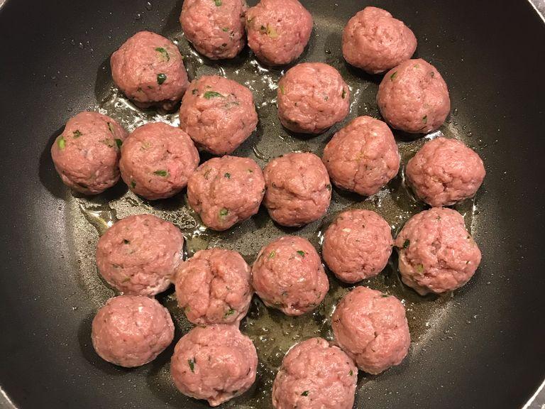 Shape the meat into walnut-sized meatballs and fry them with 1 tbsp oil.